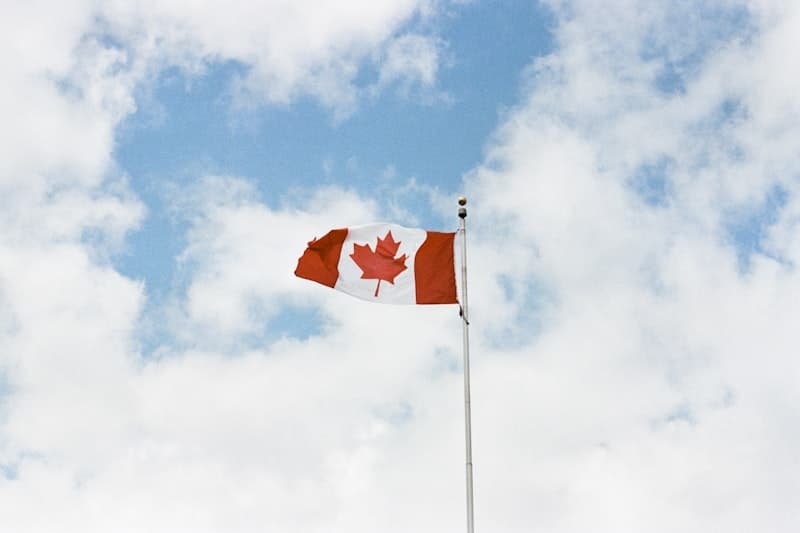 Canadian flag with Parliament Buildings in Ottawa