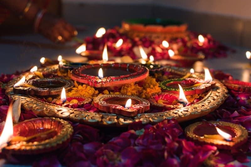 Beautiful Diwali diyas and colorful rangoli decorations